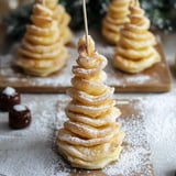 A star-shaped flaky pastry dusted with sugar sits front and center, with several similar tree-shaped treats visible behind it.